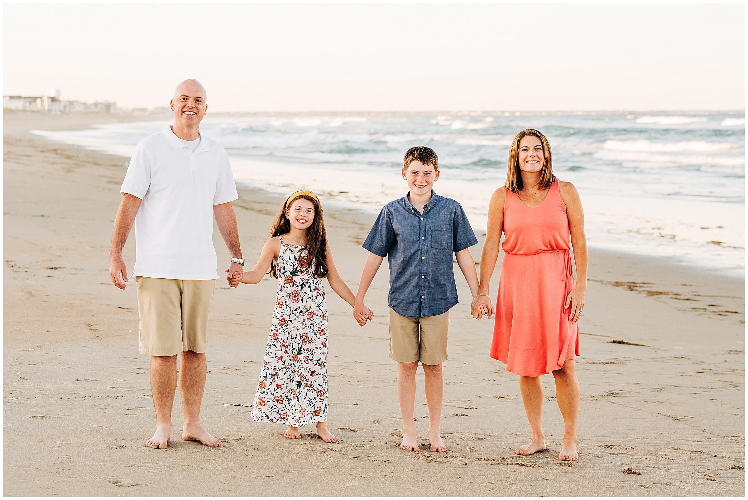 A family walks on the beach