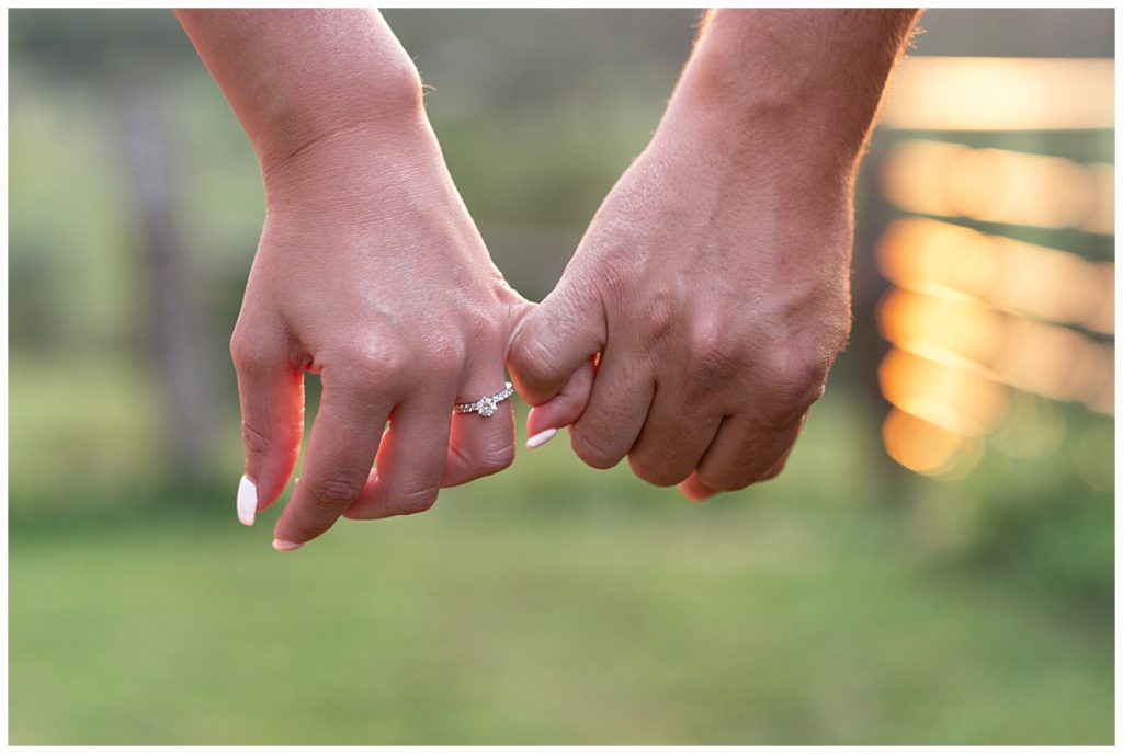 Two pinky fingers holding hands